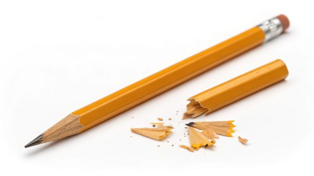Sharp pencil broken pencil wood yellow graphite mess stress awareness day minimal Calm scene of sharp pencil near broken pencil with wood chips