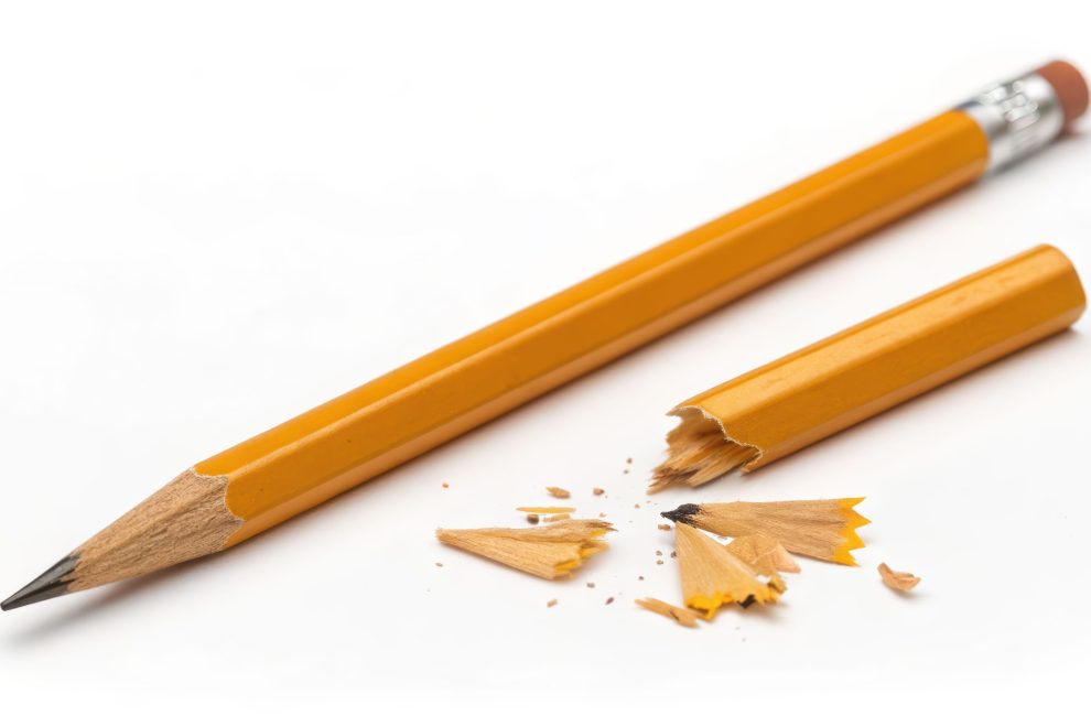 Sharp pencil broken pencil wood yellow graphite mess stress awareness day minimal Calm scene of sharp pencil near broken pencil with wood chips